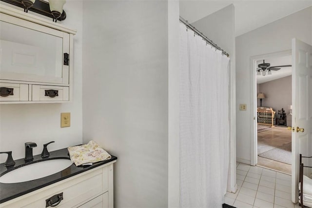 bathroom with tile patterned flooring and vanity