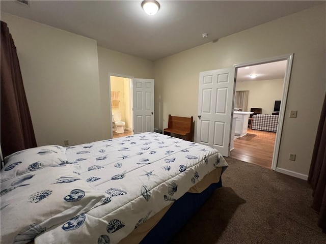 bedroom with baseboards, carpet, and ensuite bathroom