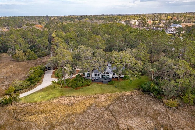 aerial view featuring a wooded view