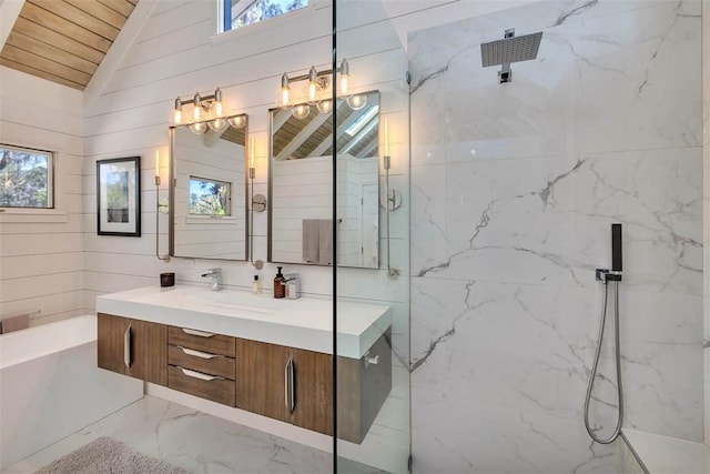 full bathroom featuring lofted ceiling, a garden tub, vanity, marble finish floor, and a marble finish shower