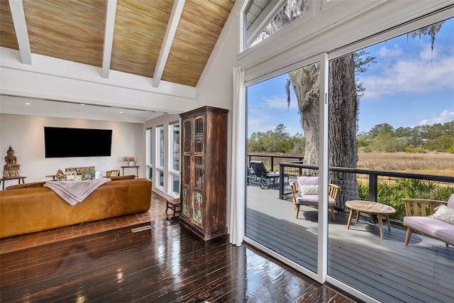 interior space featuring a wealth of natural light, beam ceiling, wooden ceiling, and hardwood / wood-style flooring