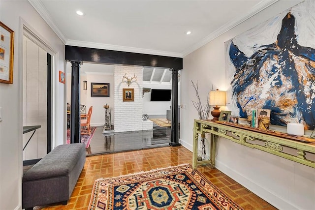 interior space featuring ornate columns, baseboards, brick floor, and crown molding