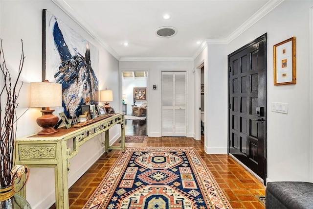 foyer entrance with brick floor, recessed lighting, crown molding, and baseboards