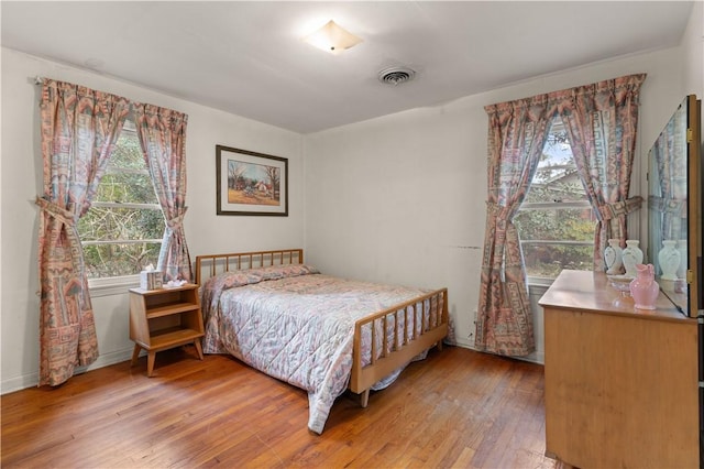 bedroom featuring light hardwood / wood-style floors