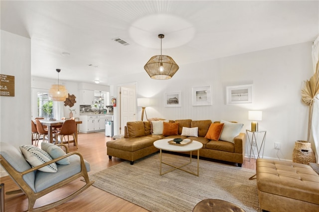 501 W Hall St, Saint Marys, GA 31558 - living area featuring visible vents and light wood-style flooring