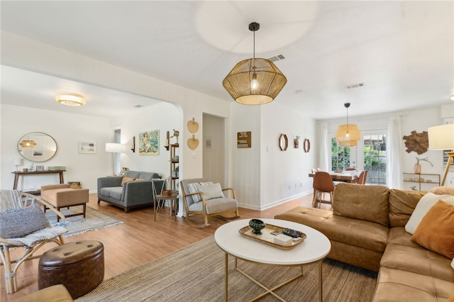 501 W Hall St, Saint Marys, GA 31558 - living room featuring wood finished floors, visible vents, and baseboards