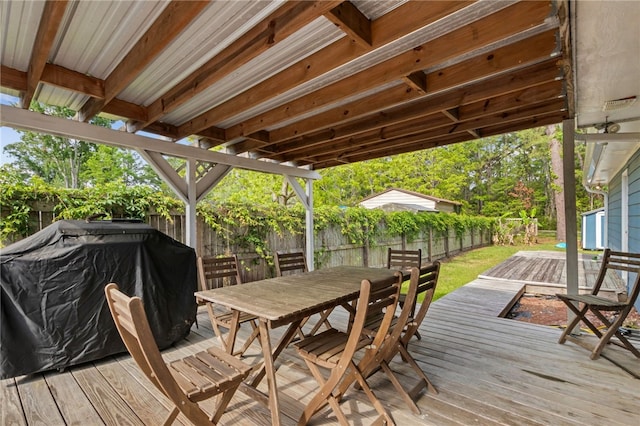 501 W Hall St, Saint Marys, GA 31558 - wooden deck featuring a fenced backyard and outdoor dining area