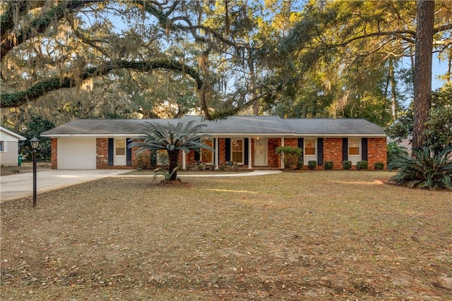 single story home with a front yard and a garage