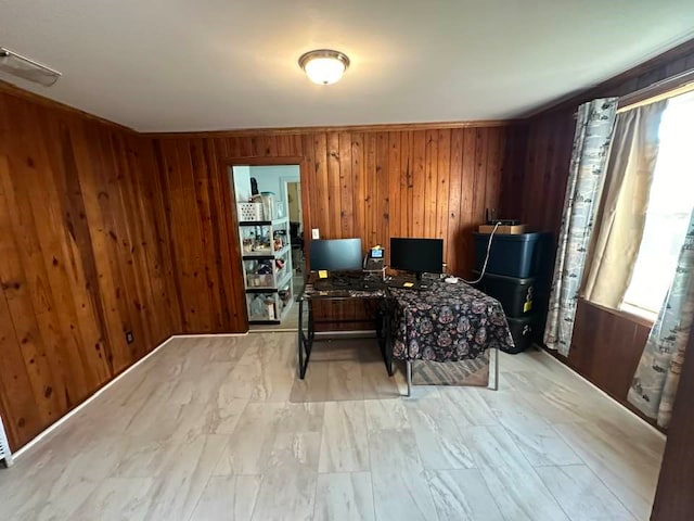 office area with plenty of natural light and wooden walls