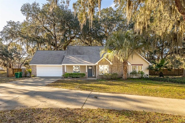 single story home with driveway, an attached garage, fence, and a front yard