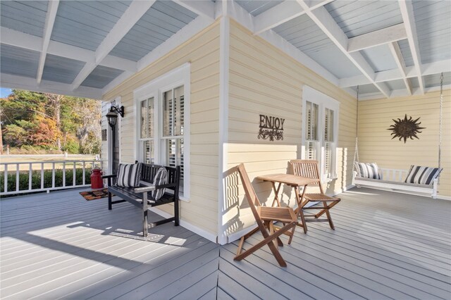 wooden terrace with covered porch and french doors