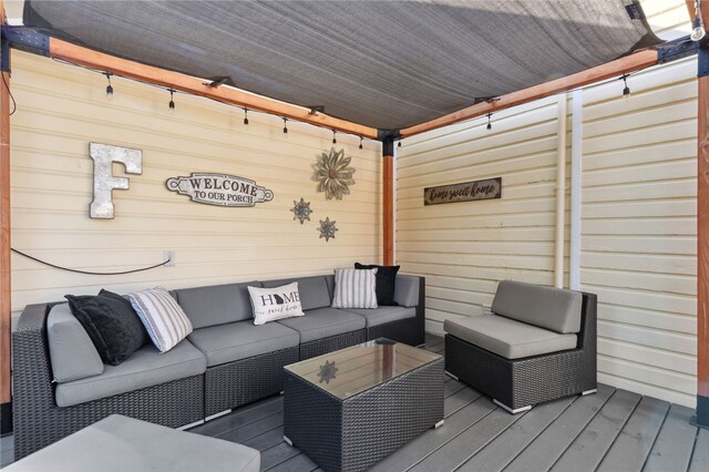 wooden terrace featuring outdoor lounge area