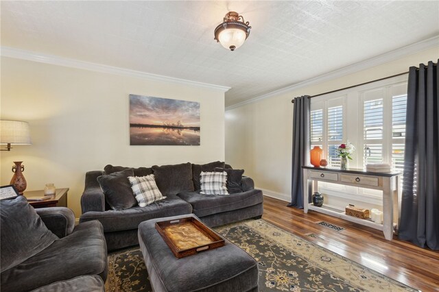 living room featuring hardwood / wood-style floors and crown molding