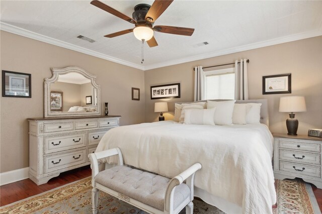 bedroom featuring ceiling fan, dark hardwood / wood-style flooring, and ornamental molding