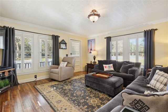 living room featuring crown molding, plenty of natural light, and dark wood-type flooring