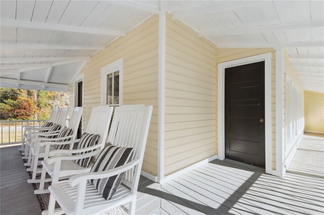 wooden deck featuring covered porch