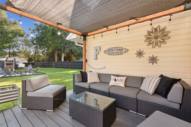 wooden terrace with an outdoor living space and a lawn