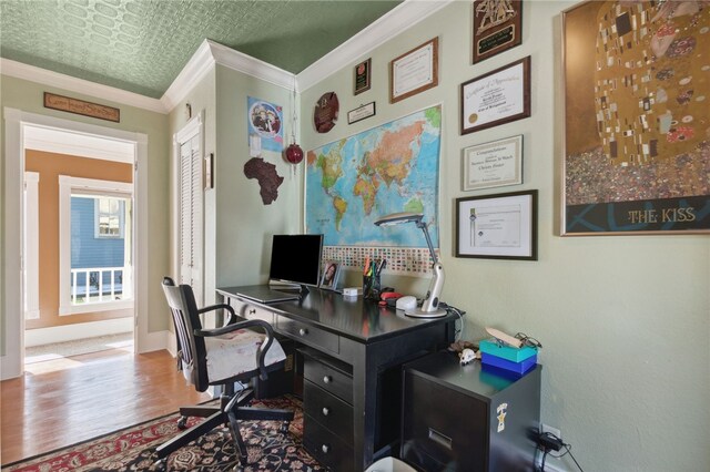 office space featuring ornamental molding and hardwood / wood-style flooring