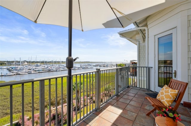 balcony featuring a water view