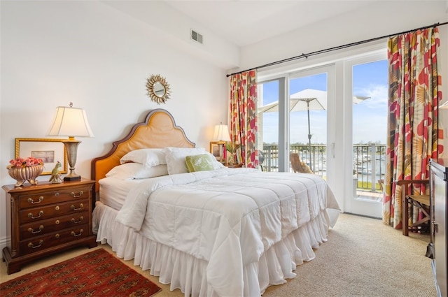 carpeted bedroom featuring access to outside