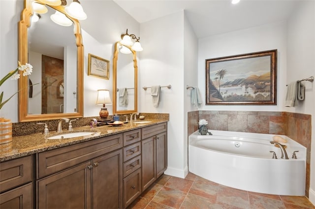 bathroom featuring vanity and separate shower and tub