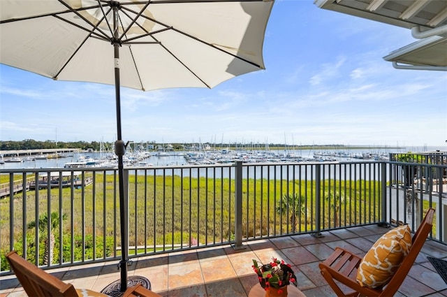 balcony featuring a water view