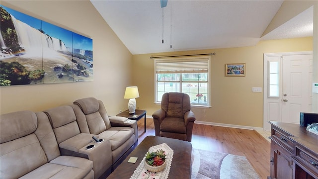 living room with lofted ceiling and light wood-type flooring