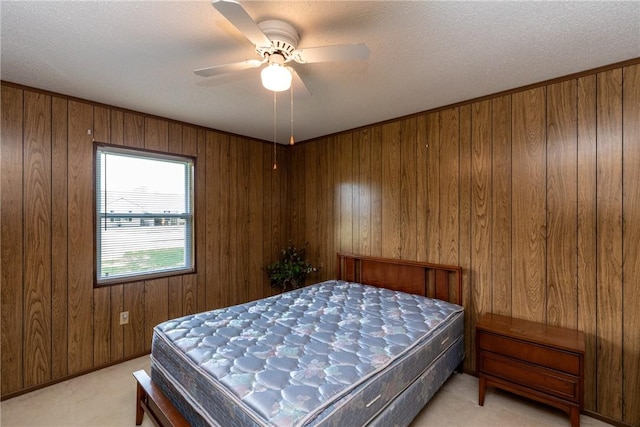 2320 Ben Hill Ave, Waycross, GA 31501 - bedroom with light colored carpet, wooden walls, and ceiling fan