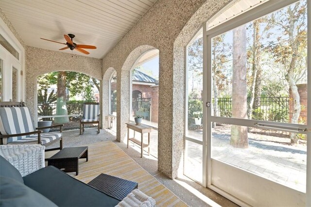 exterior space featuring hardwood / wood-style flooring and ceiling fan