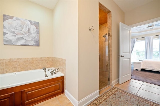 ensuite bathroom featuring ensuite bathroom, a shower stall, a garden tub, and tile patterned floors