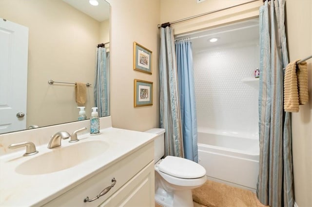 full bath featuring shower / tub combo with curtain, vanity, and toilet