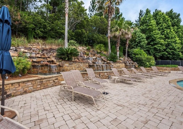 view of patio / terrace featuring fence