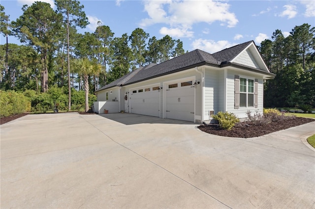 view of side of home featuring a garage