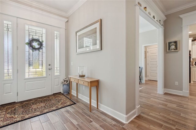 entrance foyer featuring light hardwood / wood-style flooring and crown molding