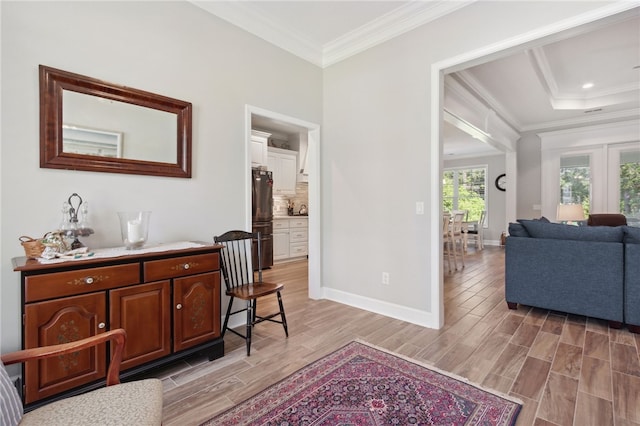 interior space featuring light hardwood / wood-style floors and crown molding