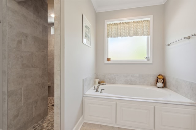 bathroom featuring shower with separate bathtub, tile patterned floors, and crown molding