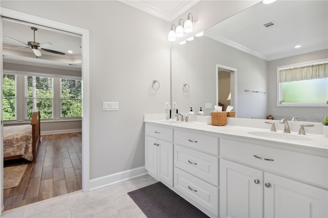 bathroom featuring vanity, hardwood / wood-style flooring, ceiling fan, and crown molding