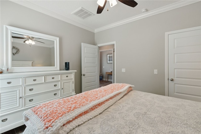 bedroom with ceiling fan and crown molding