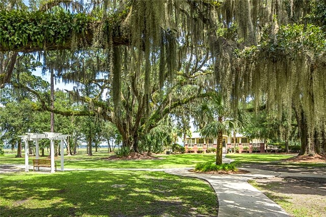 373 Harbour Island Cir, Waverly, GA 31565 - view of property's community with a pergola and a lawn