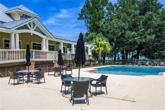 373 Harbour Island Cir, Waverly, GA 31565 - community pool featuring a patio and a ceiling fan
