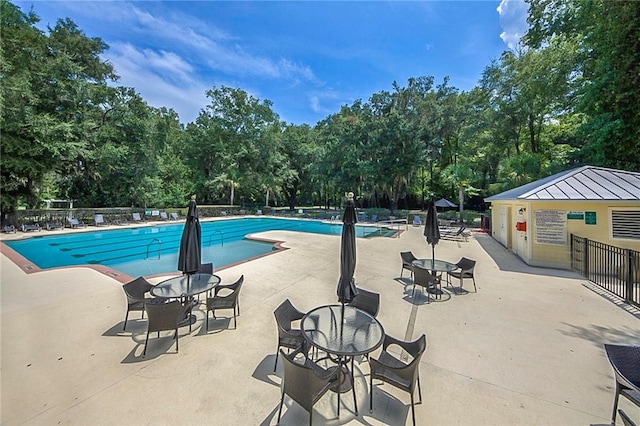 373 Harbour Island Cir, Waverly, GA 31565 - community pool with view of scattered trees and a patio