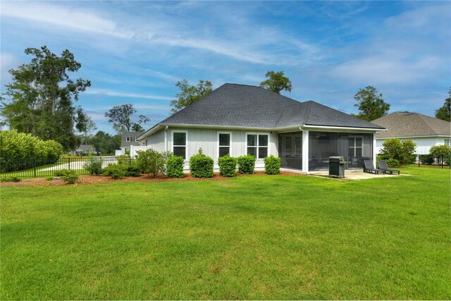373 Harbour Island Cir, Waverly, GA 31565 - back of property with a sunroom and roof with shingles