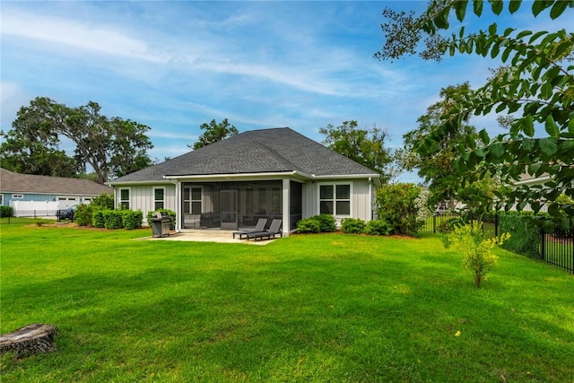 373 Harbour Island Cir, Waverly, GA 31565 - rear view of house with a sunroom, a fenced backyard, a patio, roof with shingles, and board and batten siding