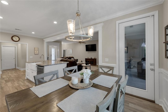 373 Harbour Island Cir, Waverly, GA 31565 - dining area with light wood finished floors, ornamental molding, recessed lighting, and a chandelier