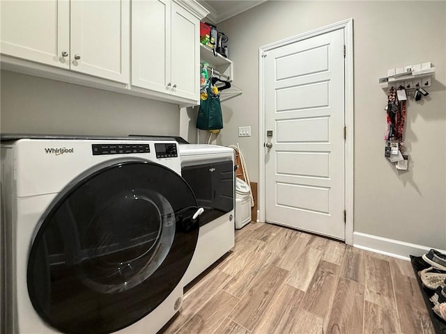 373 Harbour Island Cir, Waverly, GA 31565 - laundry room with cabinet space, washer and clothes dryer, light wood-style flooring, and ornamental molding
