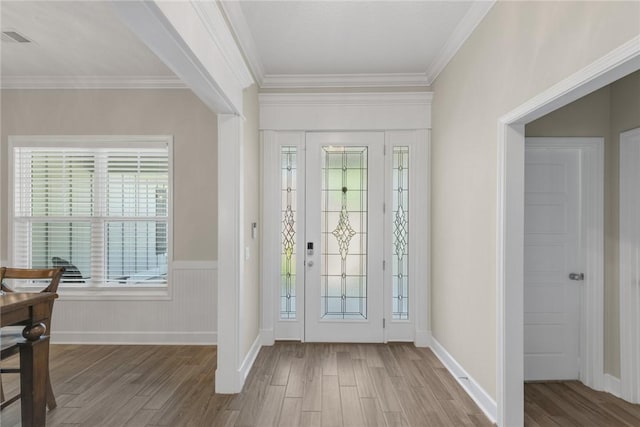 373 Harbour Island Cir, Waverly, GA 31565 - entrance foyer with wood finished floors, ornamental molding, and a wainscoted wall