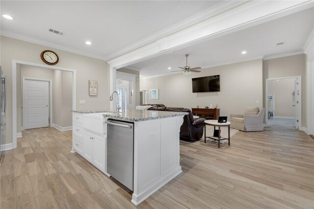 373 Harbour Island Cir, Waverly, GA 31565 - kitchen with dishwasher, an island with sink, white cabinetry, open floor plan, and light wood-style flooring