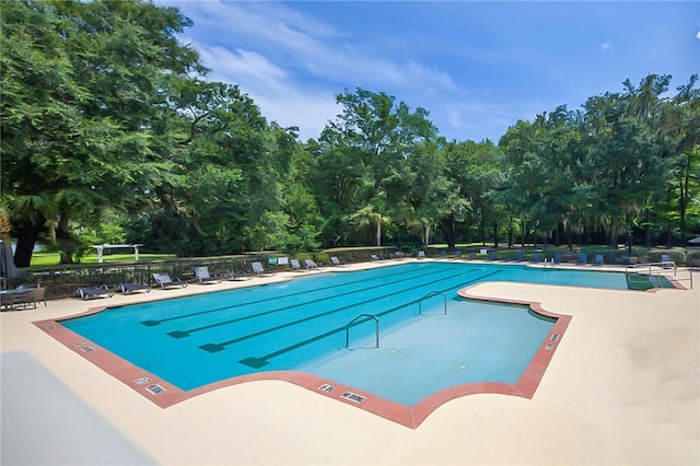 373 Harbour Island Cir, Waverly, GA 31565 - community pool with a patio and view of scattered trees