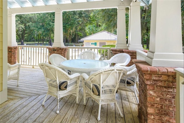 373 Harbour Island Cir, Waverly, GA 31565 - wooden porch featuring outdoor dining space