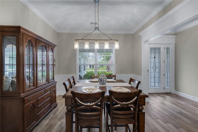 373 Harbour Island Cir, Waverly, GA 31565 - dining space featuring a wainscoted wall, dark wood finished floors, and crown molding